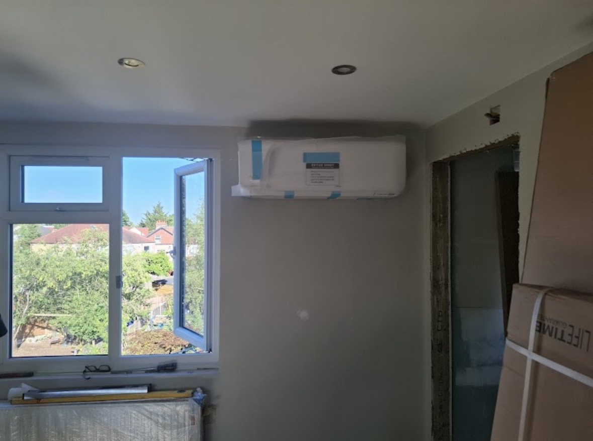 Wall-mounted split system fitted in a London bedroom